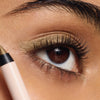 ILIA-Thru Line Waterproof Eyeliner-Makeup-ILIATHRULINEEYELINER_2026_MODEL_PORTRAIT_DEEP_1500x2000_443416a9-3f3c-47ff-bae5-a524e1574eab-The Detox Market | Portrait - Antique gold shimmer
