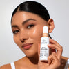 Odacite-Spf 50 Flex-Perfecting™ Mineral Drops Tinted Sunscreen-Sun Care-SPF50Tinted_model_03_bottle-The Detox Market | 03 - medium with warm undertones